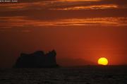 Iceberg et soleil couchant Scoresbysund
